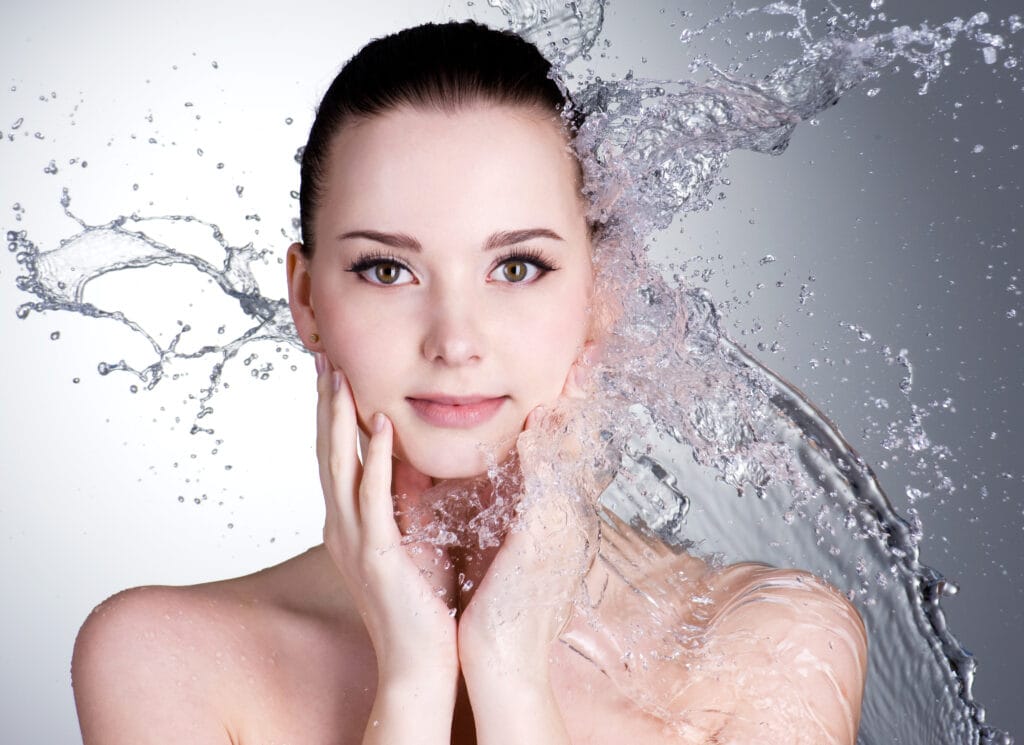 splashes water beautiful face young woman grey space 1024x745 1